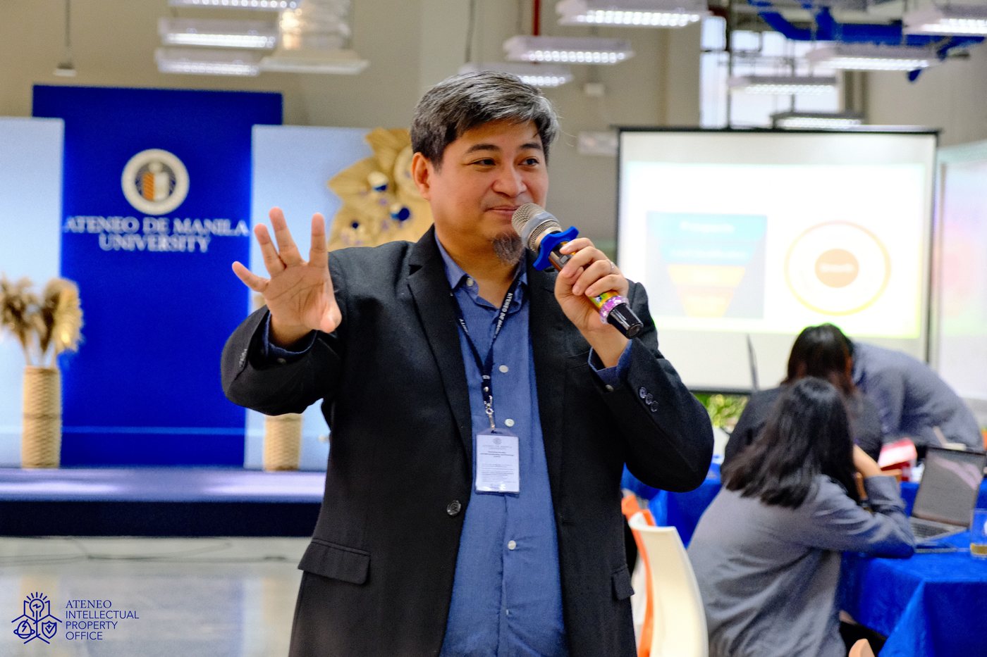 Trainer speaking at a STEP learning session at Ateneo de Manila University